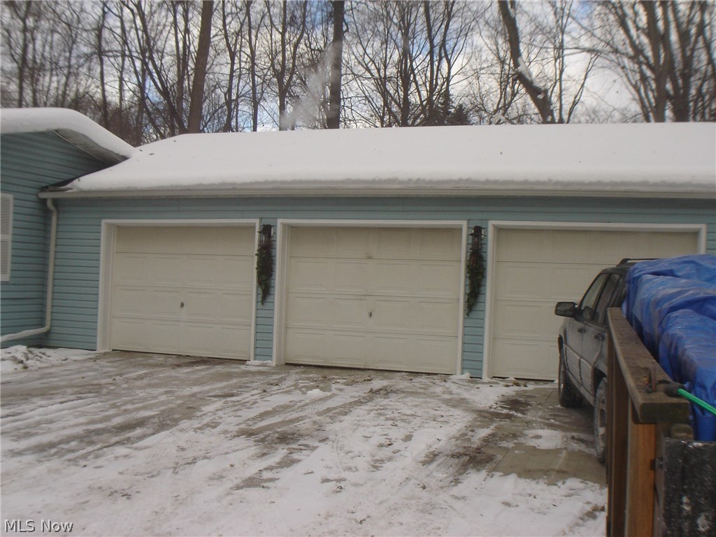 155 Riverside Drive Painesville, OH 44077 - Photo 32 of 34 Attached 3.5 car garage has its own furnace and two 220 outlets
