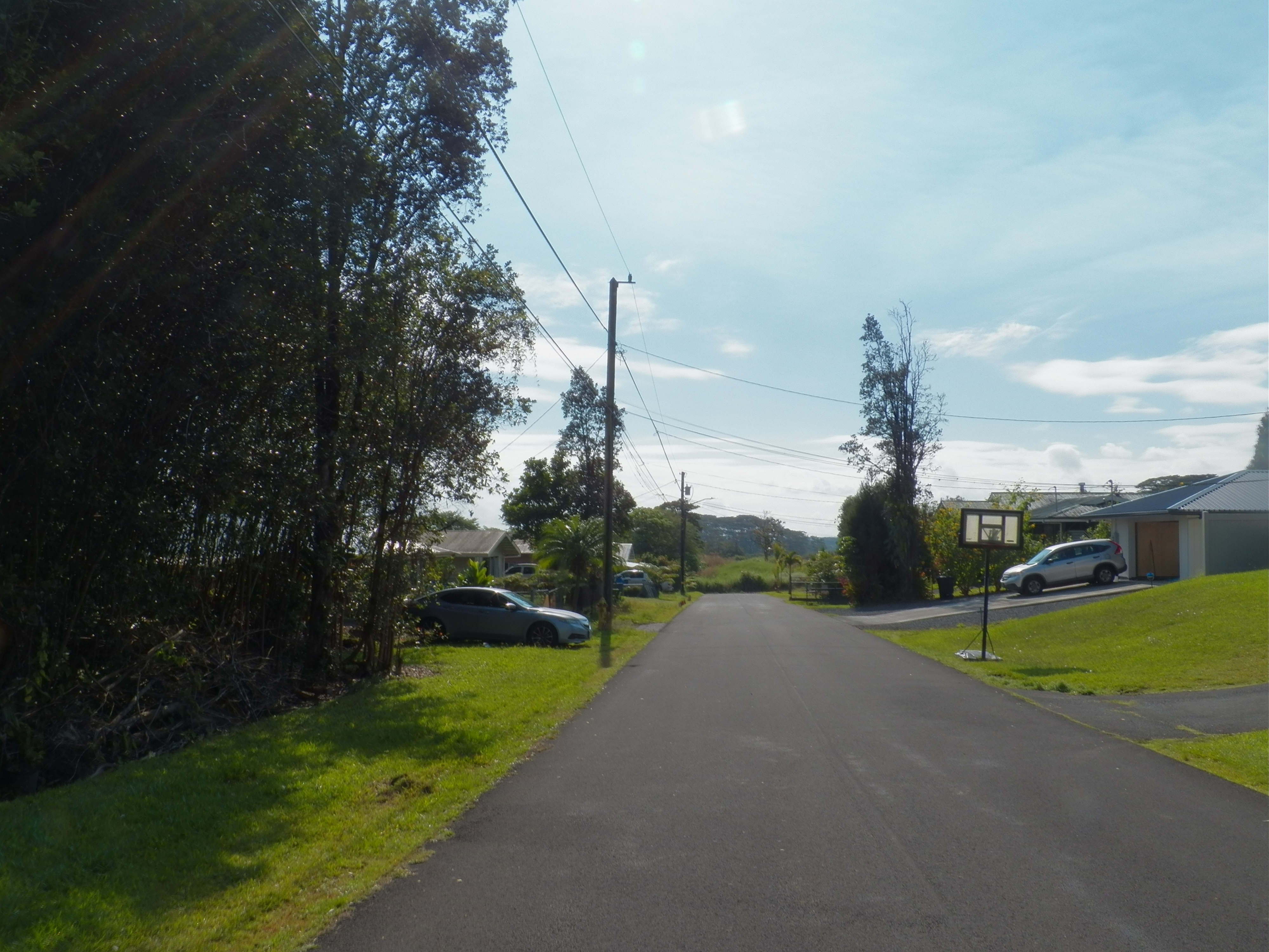 126 Kolika Road Mountain View, HI 96771 - Photo 5 of 6 a view of a road with a yard