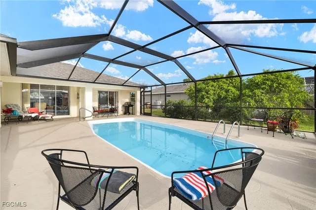 a patio with a patio table and chairs