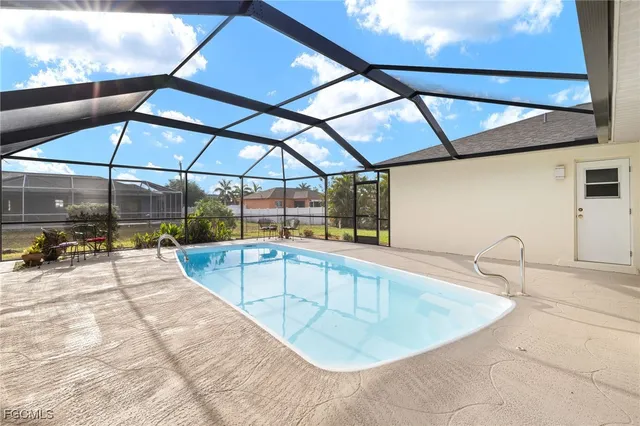 a view of a swimming pool with a lounge chairs