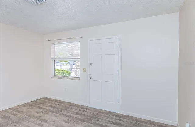 a view of an empty room with a window
