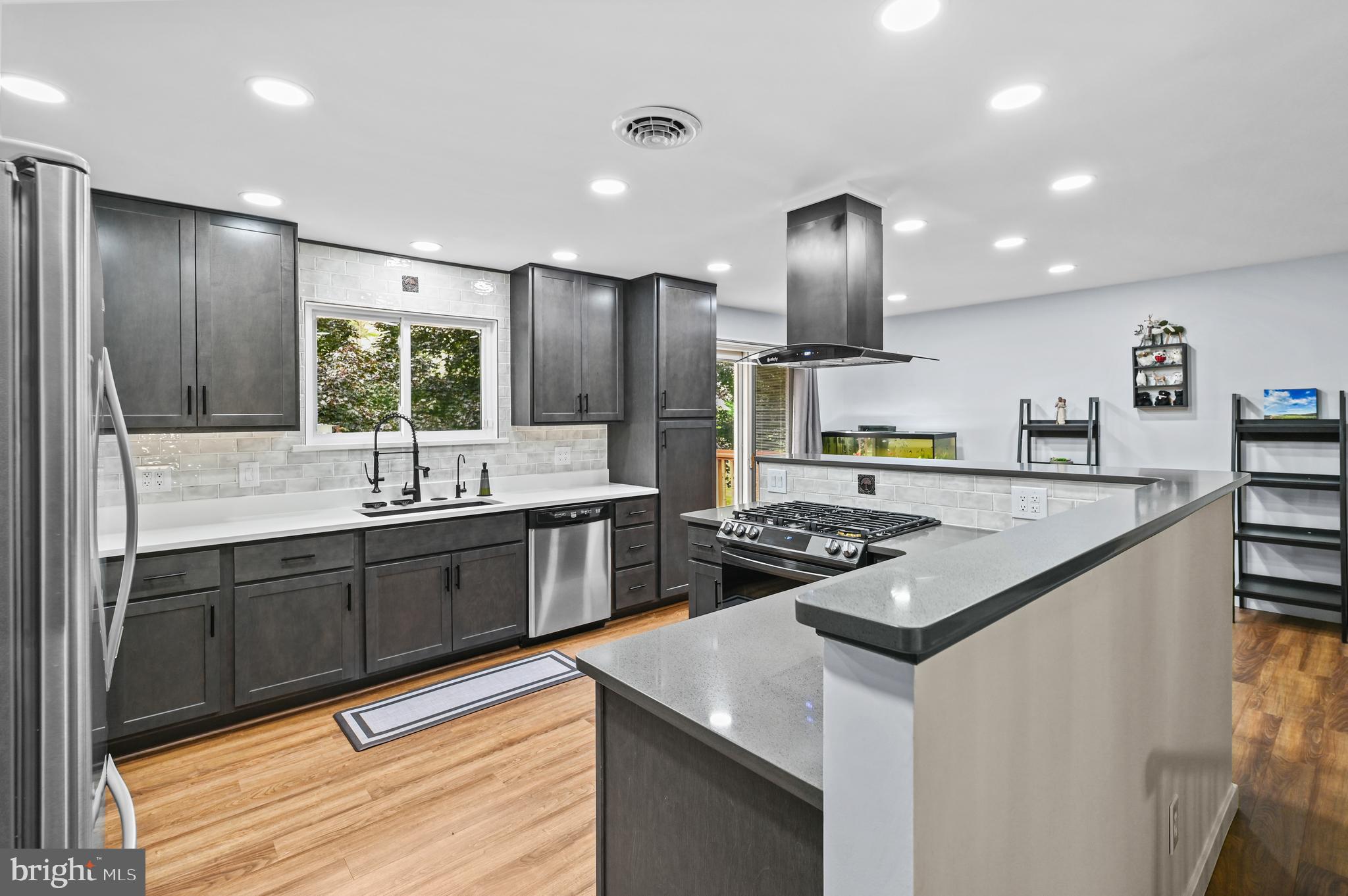 313 Faust Road Reading, PA 19608 - Photo 11 of 32 a kitchen with stainless steel appliances granite countertop a sink stove and refrigerator