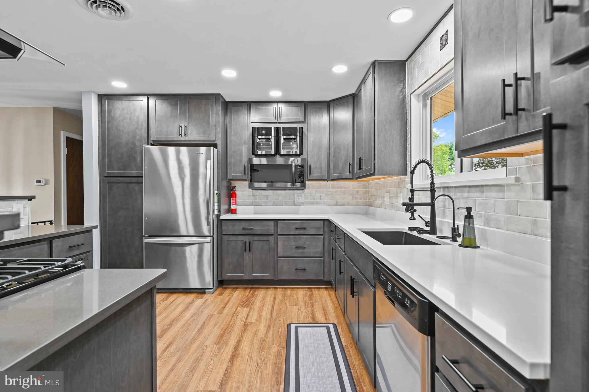 313 Faust Road Reading, PA 19608 - Photo 12 of 32 a kitchen with stainless steel appliances a refrigerator sink and stove