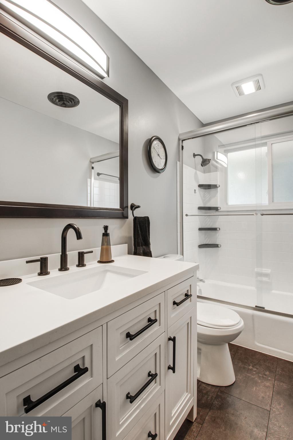313 Faust Road Reading, PA 19608 - Photo 15 of 32 a bathroom with a sink a toilet and a mirror