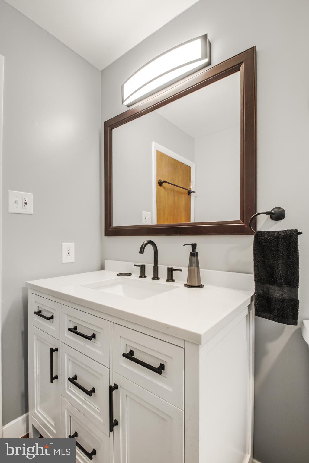 313 Faust Road Reading, PA 19608 - Photo 16 of 32 a bathroom with a sink and a mirror
