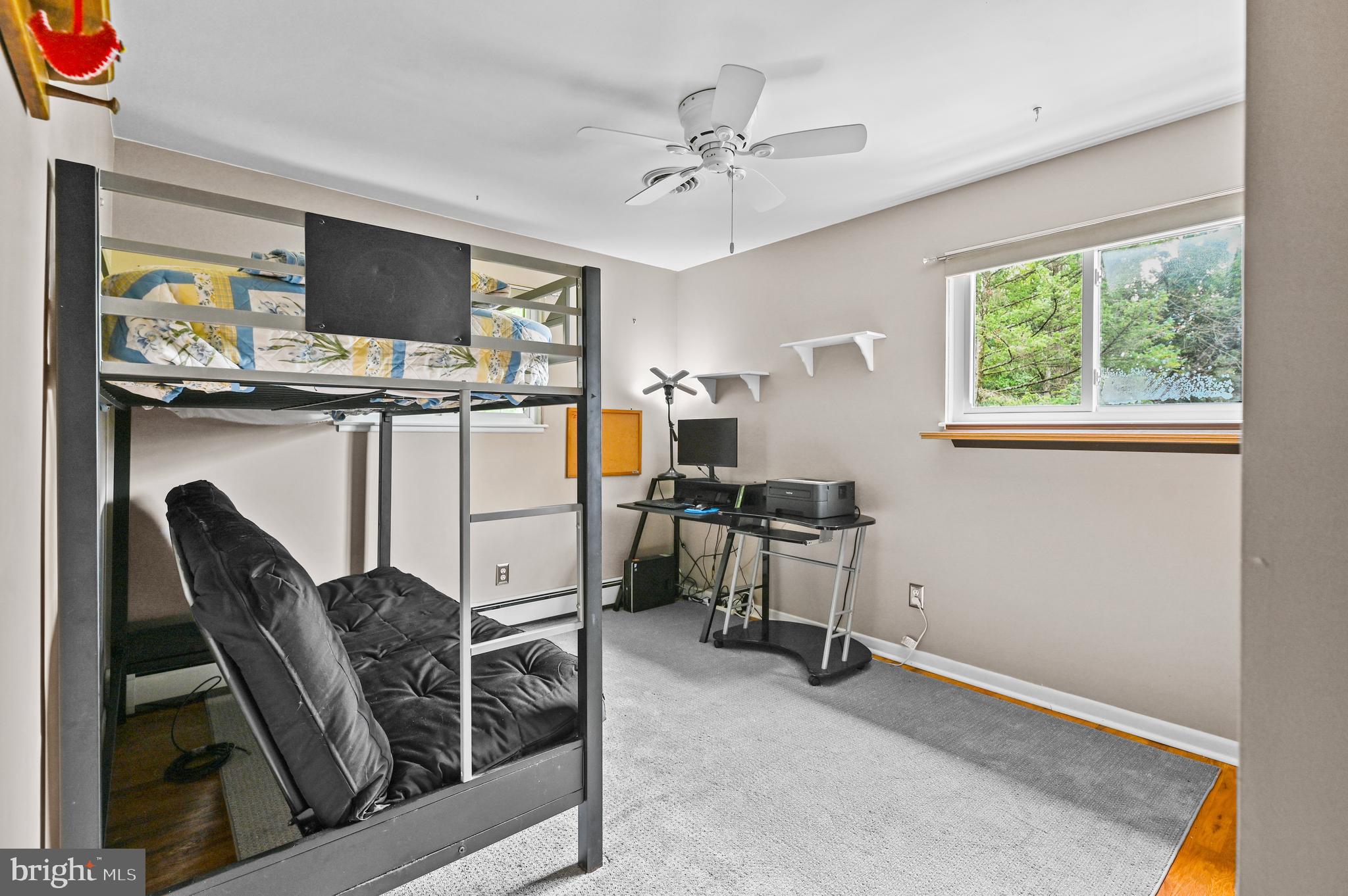 313 Faust Road Reading, PA 19608 - Photo 20 of 32 a living room with furniture a flat screen tv and a window