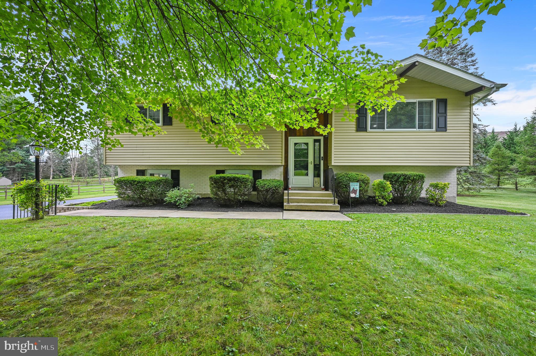 313 Faust Road Reading, PA 19608 - Photo 2 of 32 a front view of a house with garden