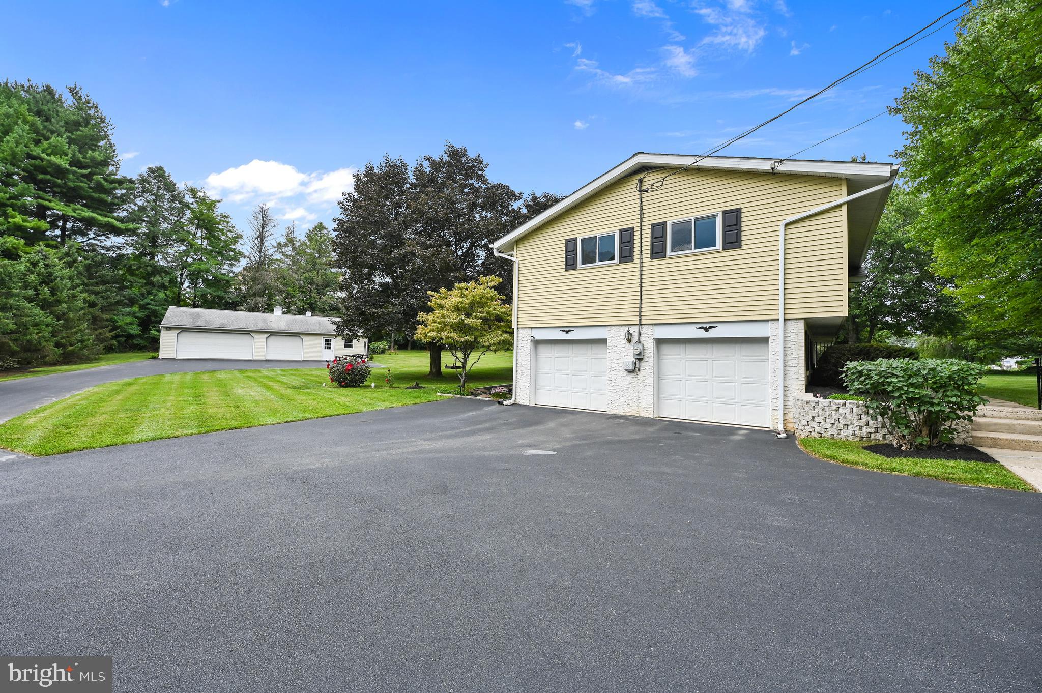 313 Faust Road Reading, PA 19608 - Photo 24 of 32 a view of a house with backyard and trees