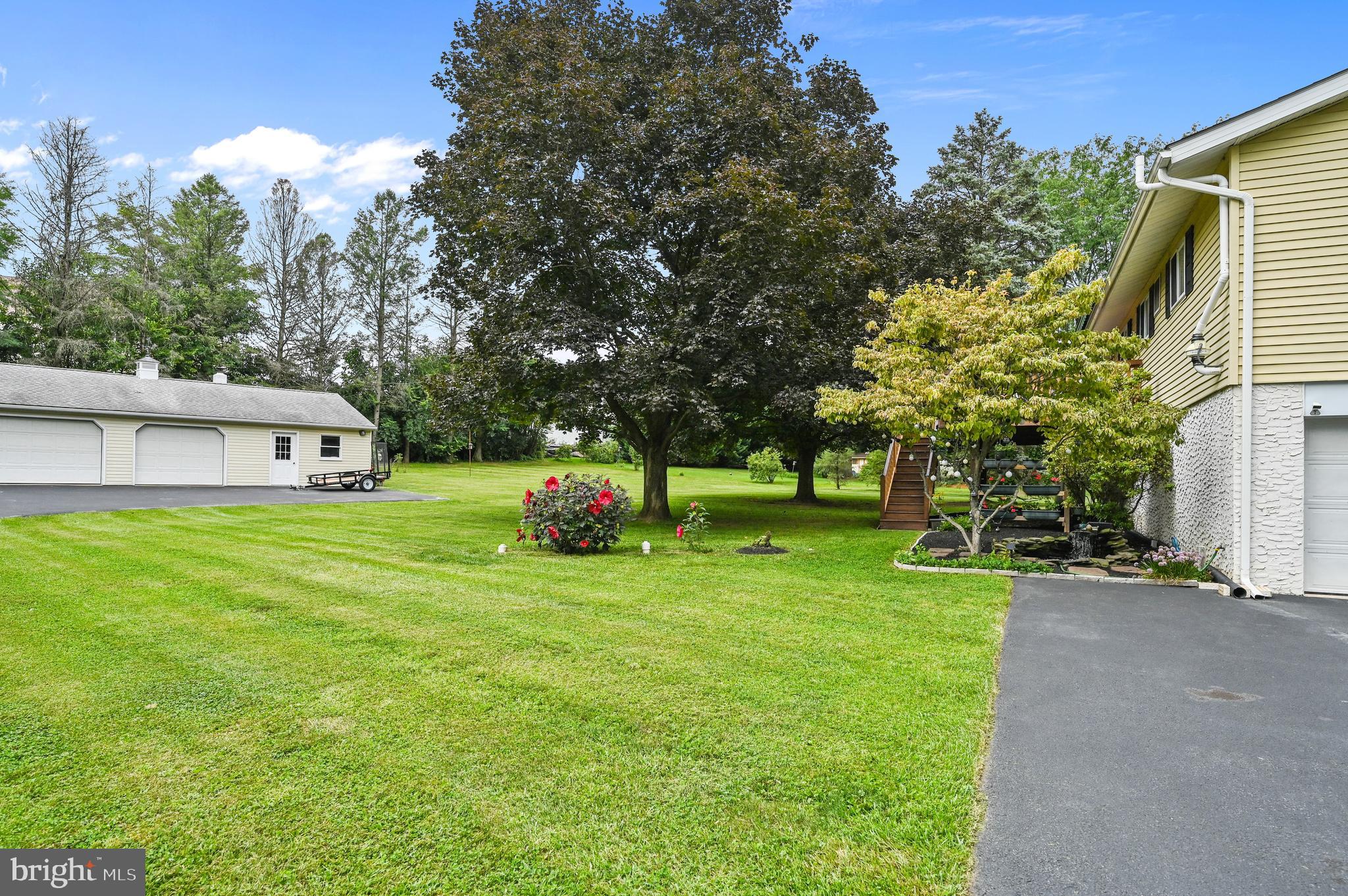 313 Faust Road Reading, PA 19608 - Photo 25 of 32 a view of a house with backyard and trees