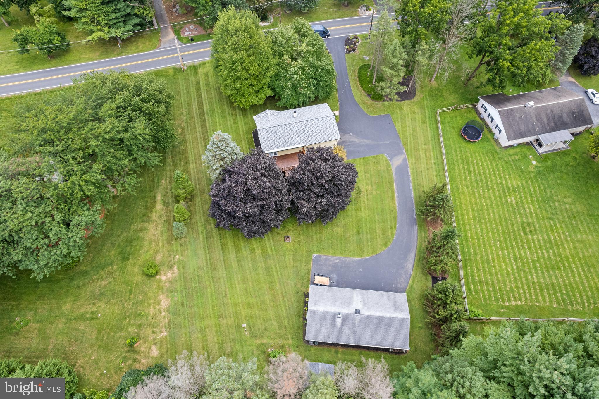 313 Faust Road Reading, PA 19608 - Photo 31 of 32 an aerial view of a house with swimming pool and garden