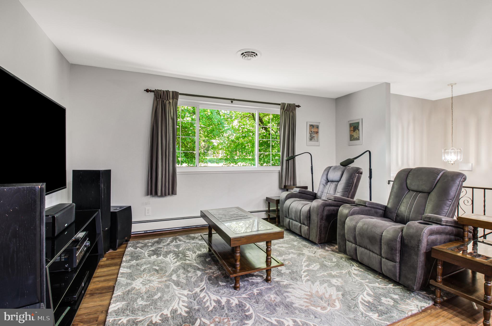 313 Faust Road Reading, PA 19608 - Photo 7 of 32 a living room with furniture a flat screen tv and a window