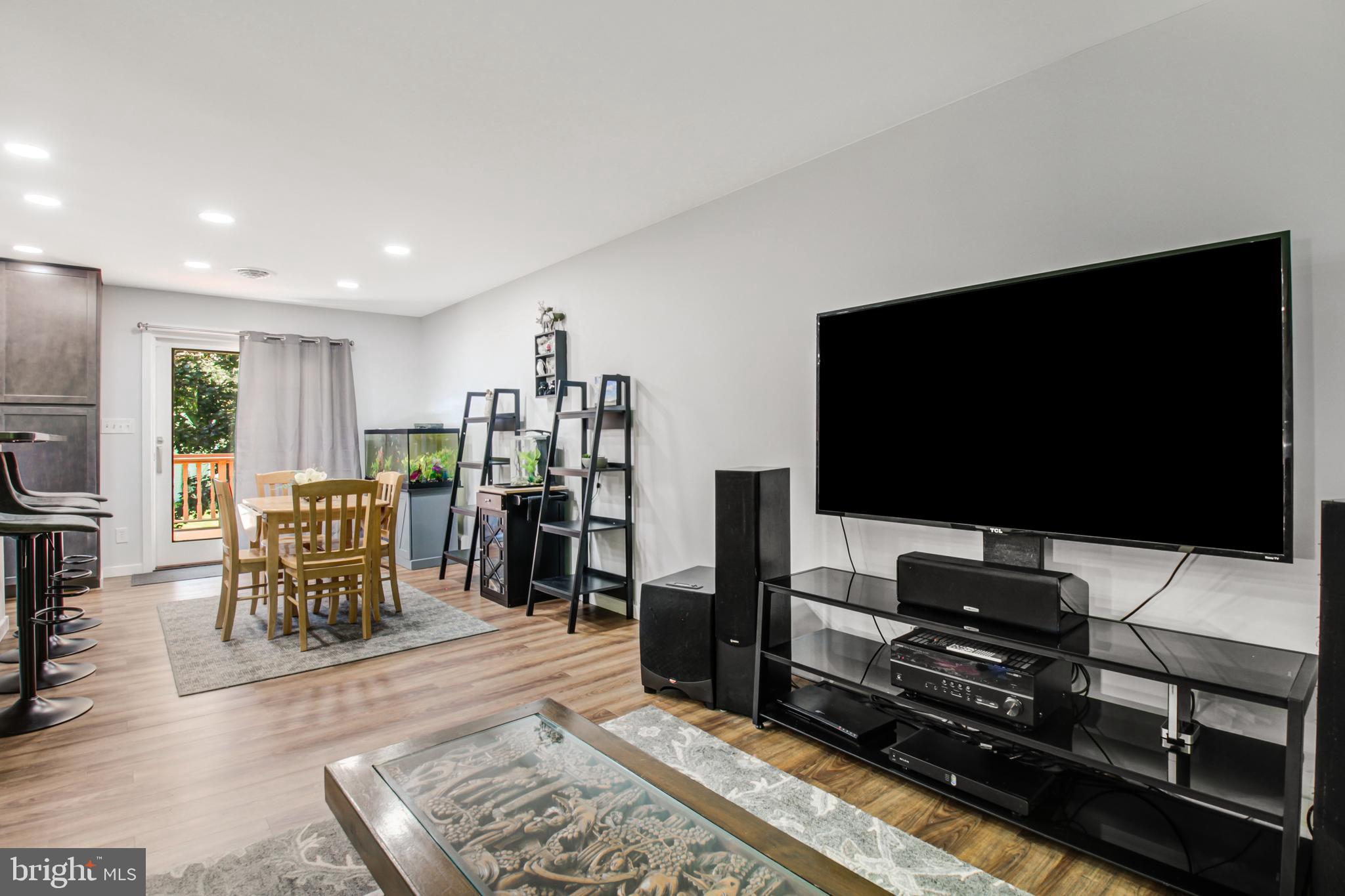 313 Faust Road Reading, PA 19608 - Photo 9 of 32 a living room with furniture and a flat screen tv