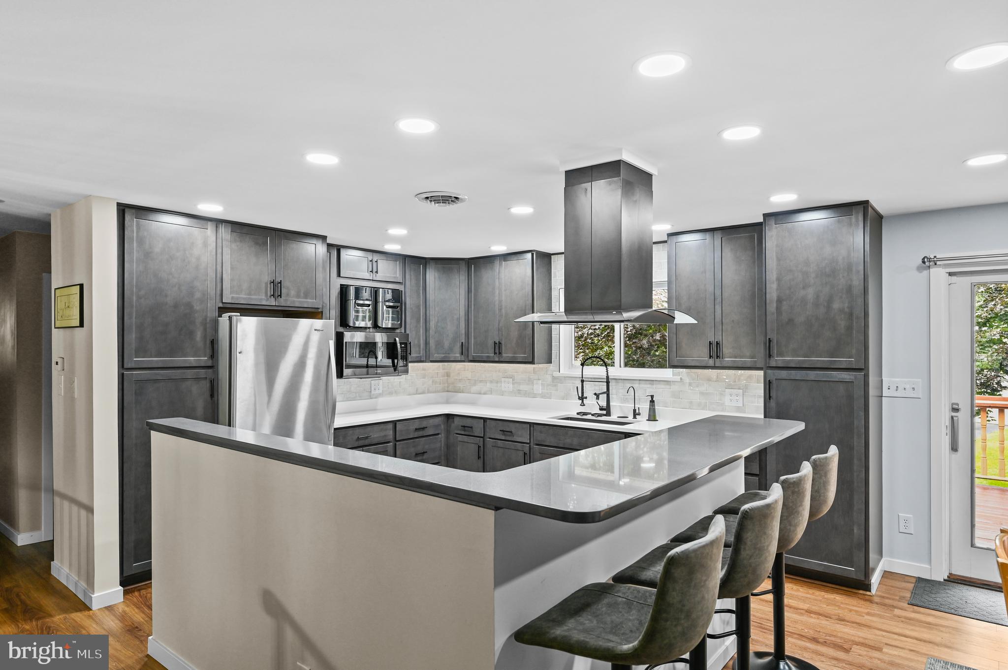 313 Faust Road Reading, PA 19608 - Photo 10 of 32 a kitchen with stainless steel appliances granite countertop a sink and a refrigerator