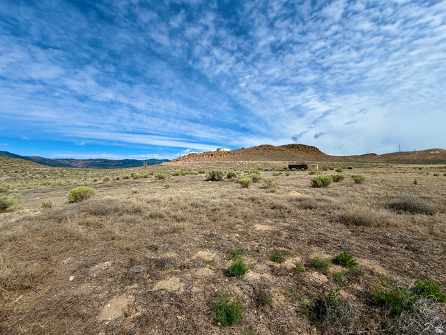 600 East E Street Moroni, UT 84646 - Photo 35 of 38 Expansive land parcel featuring natural, arid vegetation and distant mountainous terrain