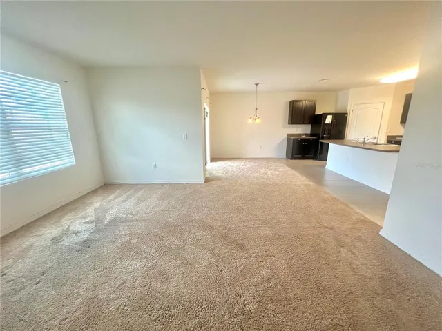 a view of kitchen with furniture and a window