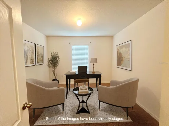 a living room with couches a coffee table and a window with wooden floor