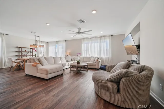 a bedroom with two beds and painting on the wall