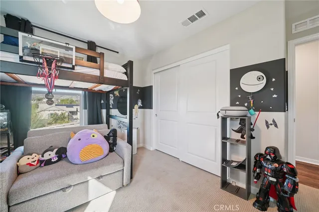 a spacious bathroom with a double vanity sink a mirror and a