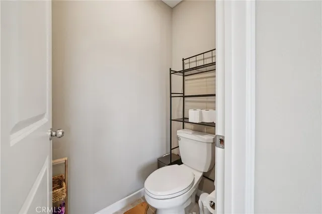 a view of a workspace with furniture and a flat screen tv