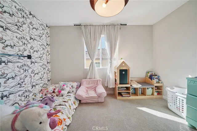 a living room with a couch and a table with wooden floor