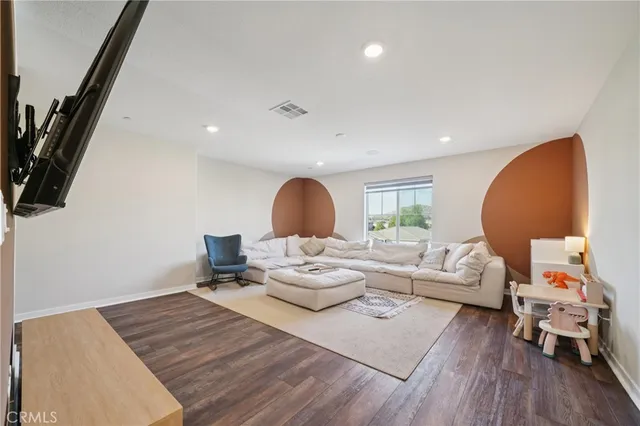 a view of a house with backyard porch and sitting area