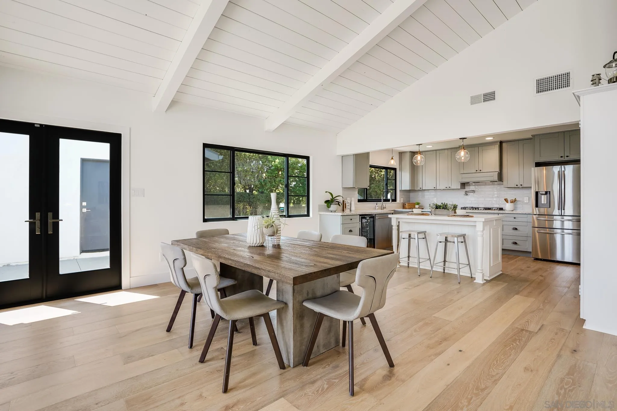 8804 Robinhood Lane La Jolla, CA 92037 - Photo 14 of 58 a view of a dining room with furniture and wooden floor