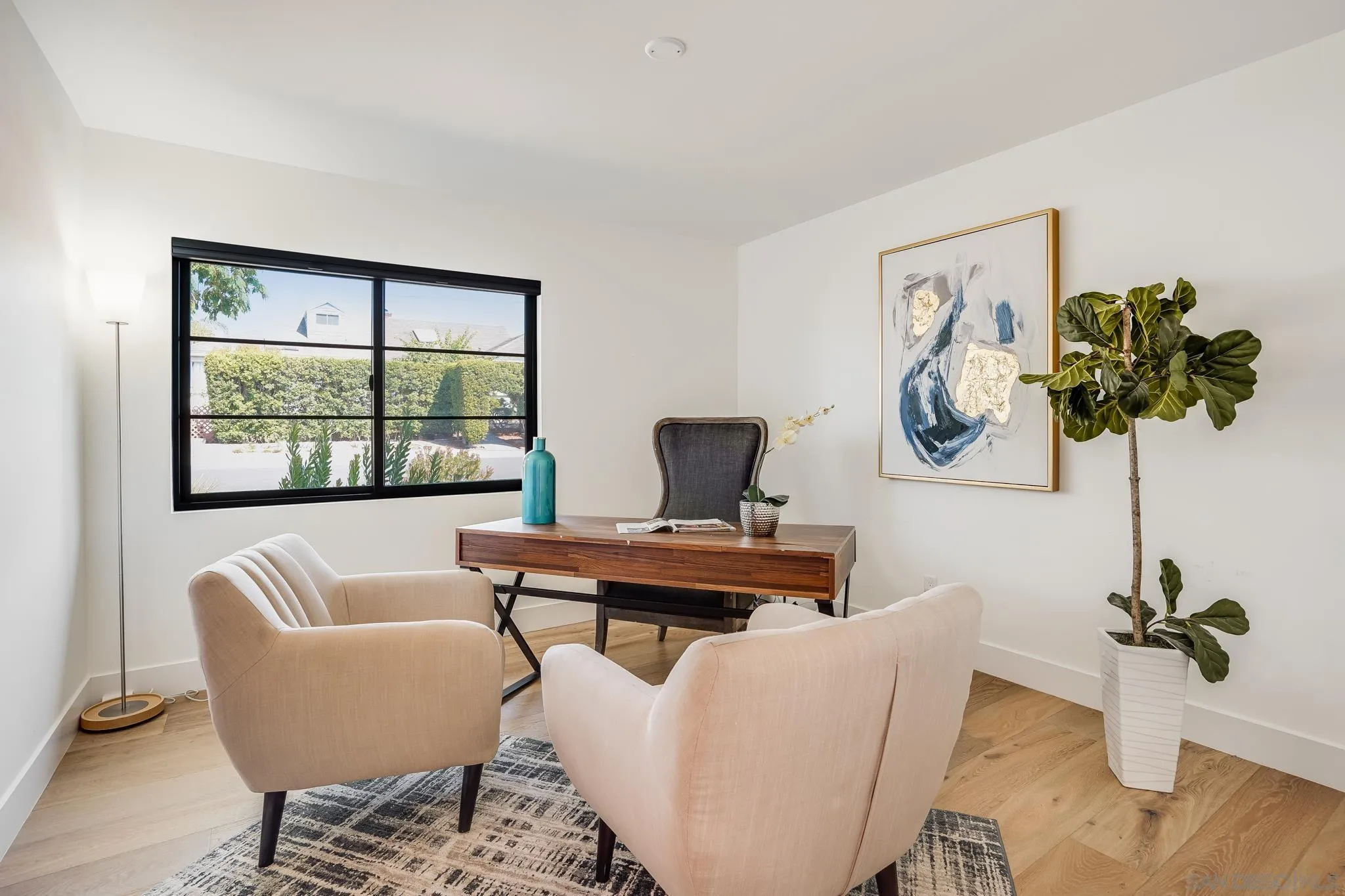 8804 Robinhood Lane La Jolla, CA 92037 - Photo 24 of 58 a living room with furniture a rug and a window