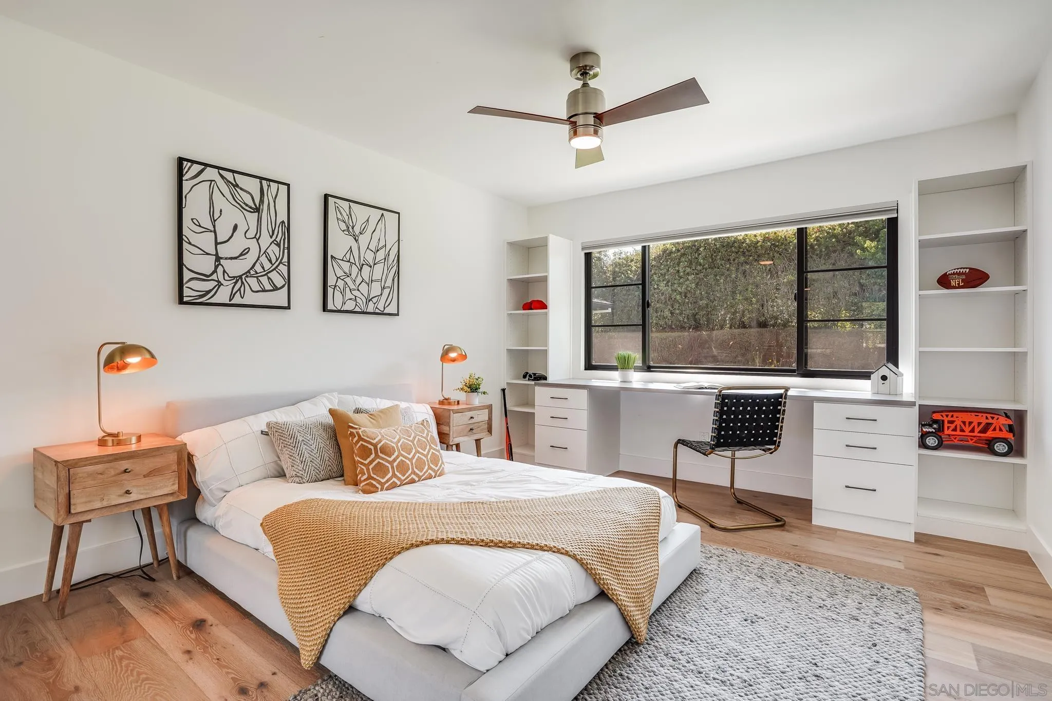 8804 Robinhood Lane La Jolla, CA 92037 - Photo 26 of 58 a bedroom with a bed and wooden floor