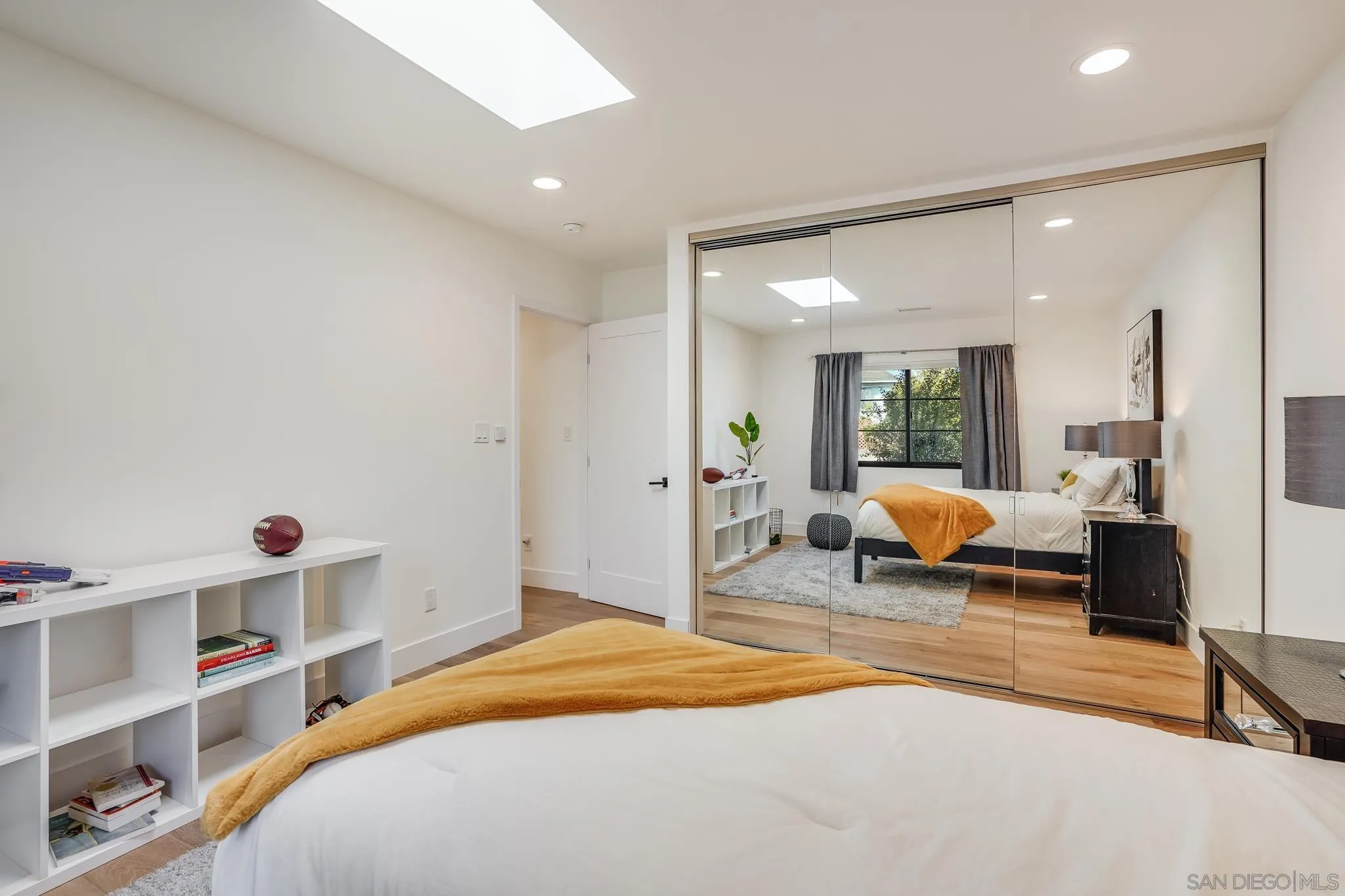 8804 Robinhood Lane La Jolla, CA 92037 - Photo 32 of 58 a bedroom with bed and a large window