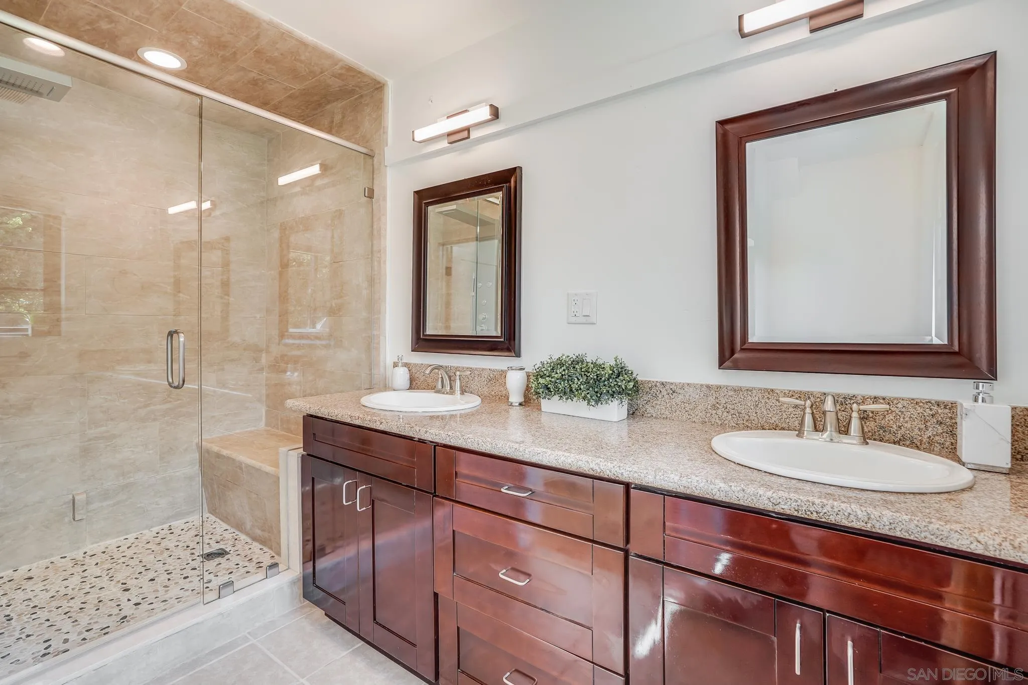 8804 Robinhood Lane La Jolla, CA 92037 - Photo 36 of 58 a bathroom with a sink and a mirror