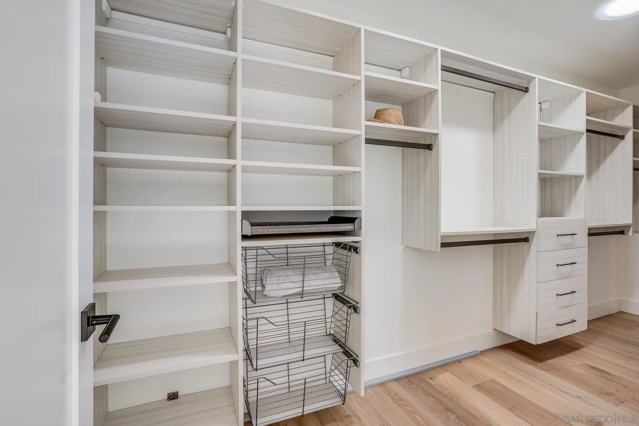 8804 Robinhood Lane La Jolla, CA 92037 - Photo 38 of 58 a view of walk in closet with empty racks