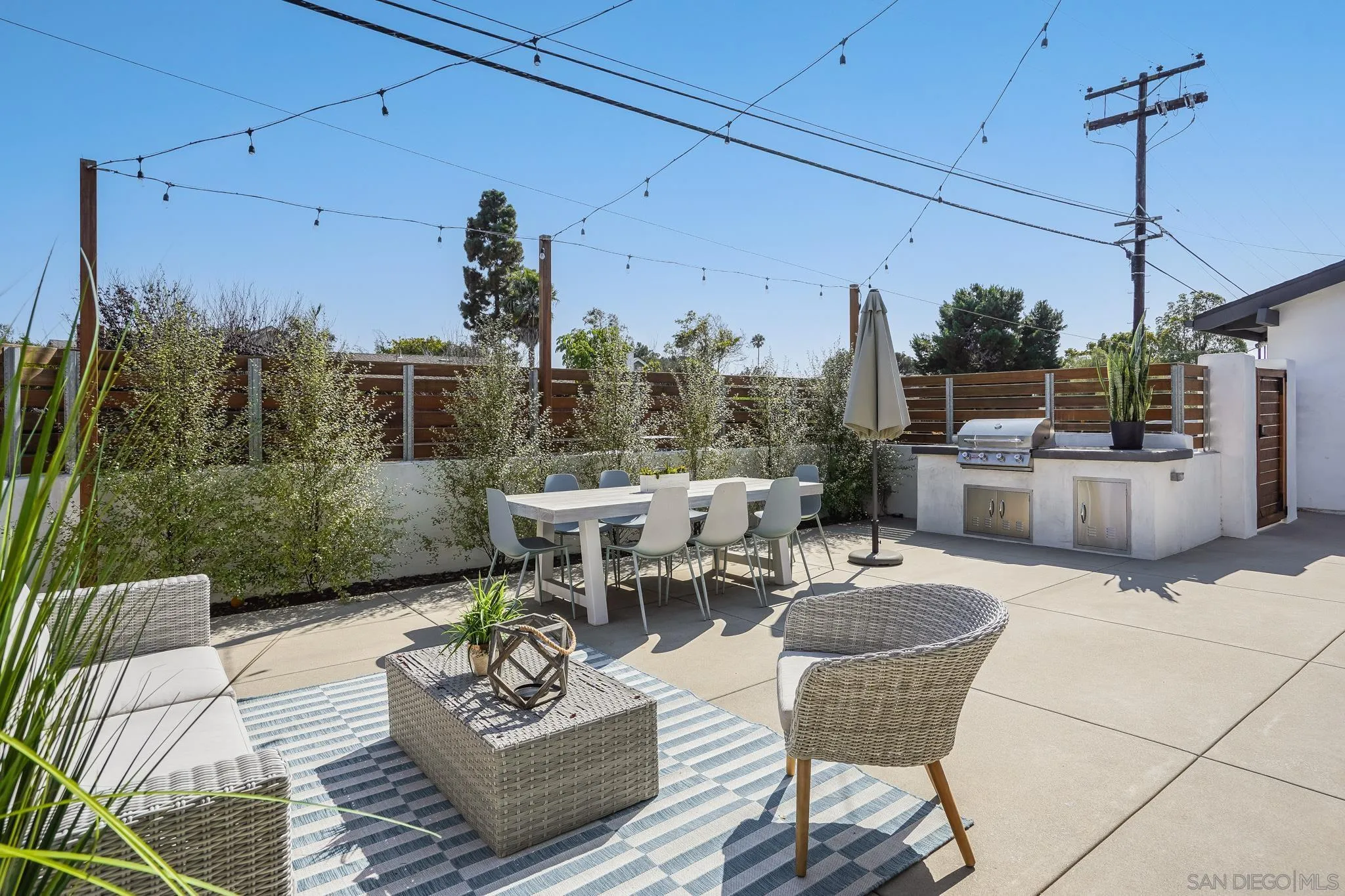 8804 Robinhood Lane La Jolla, CA 92037 - Photo 41 of 58 a view of a terrace with furniture and a potted plant