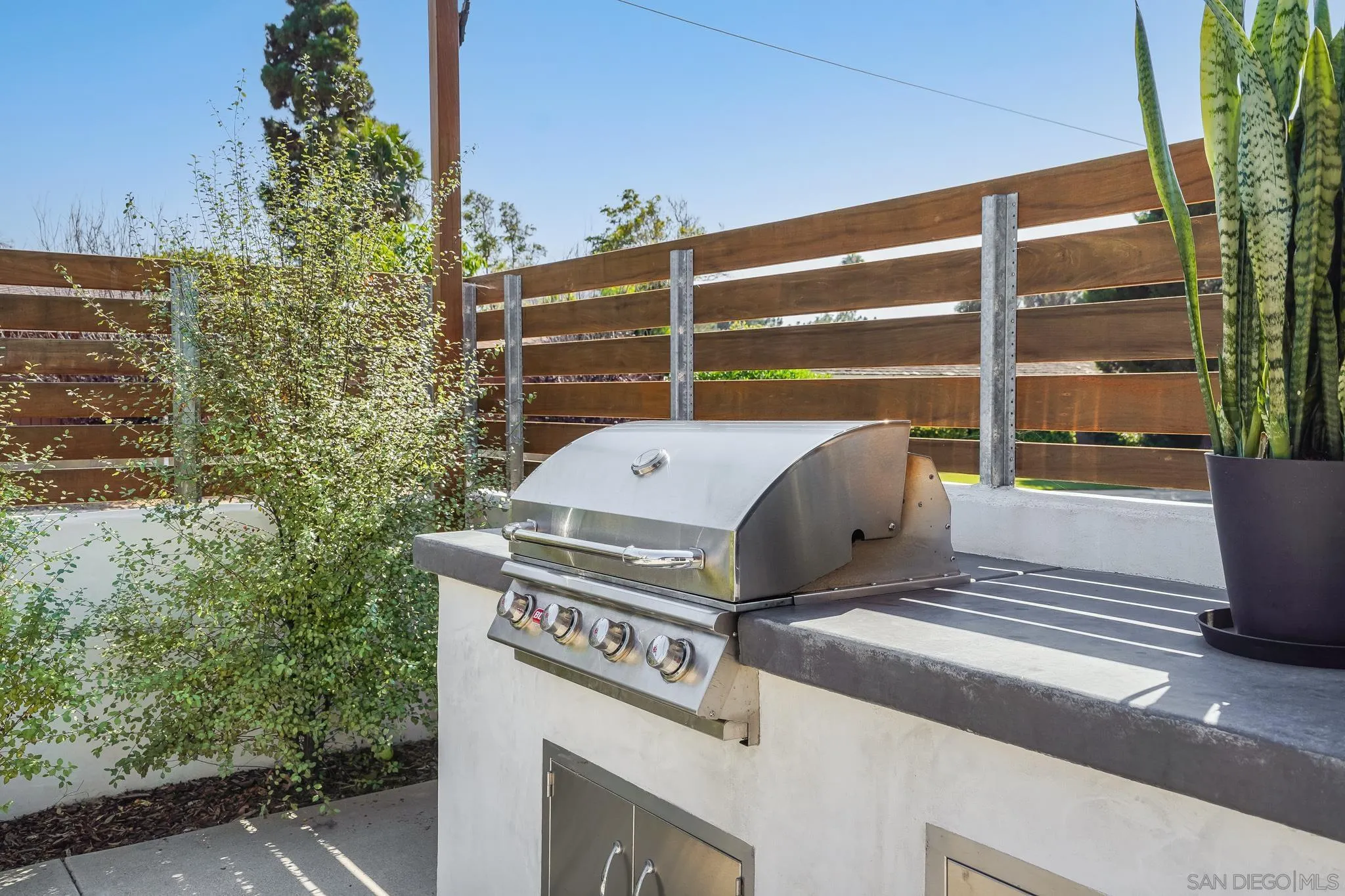 8804 Robinhood Lane La Jolla, CA 92037 - Photo 42 of 58 a view of a house with a bed and wooden floor
