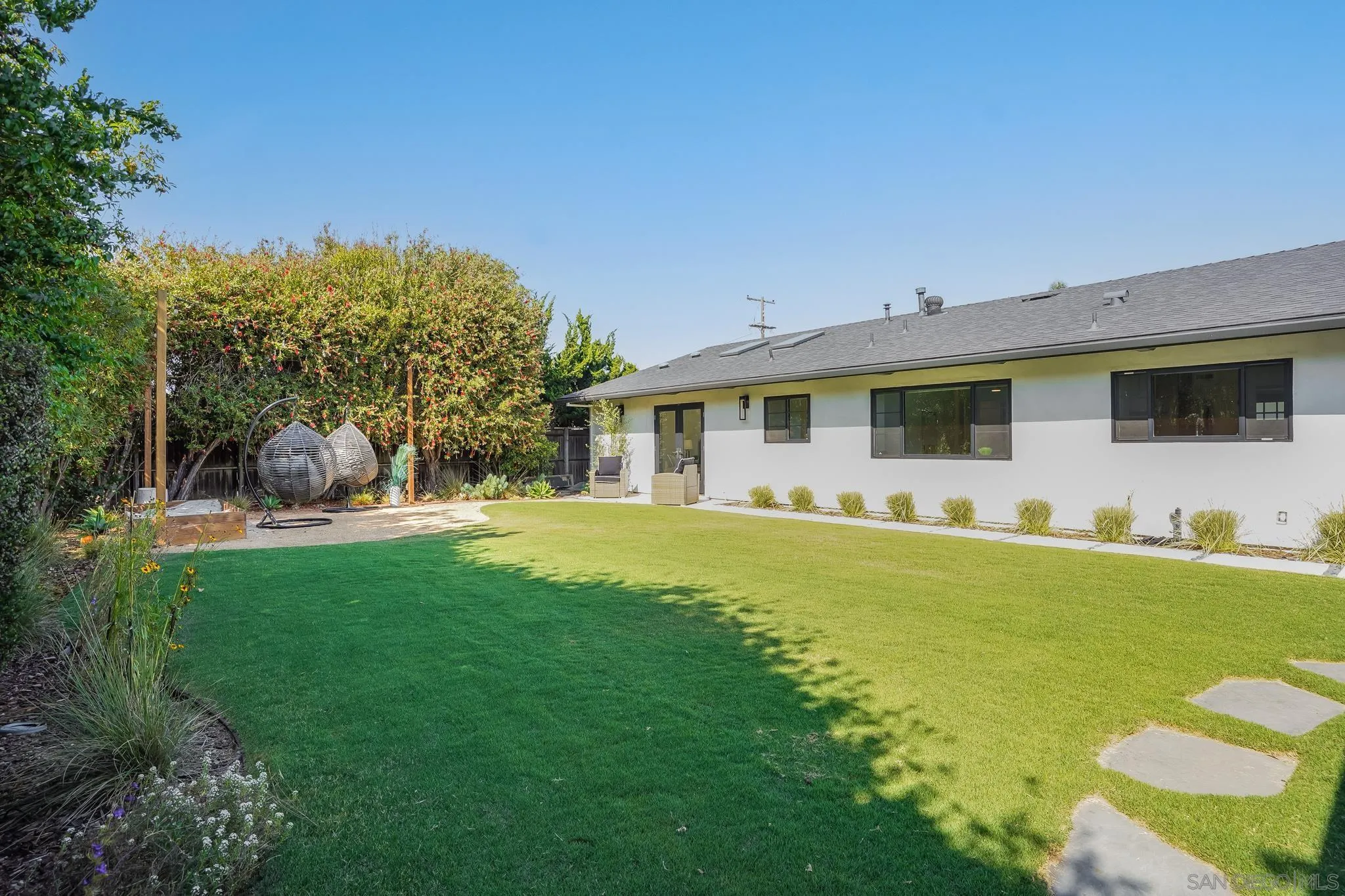 8804 Robinhood Lane La Jolla, CA 92037 - Photo 45 of 58 a front view of house with yard barbeque and outdoor seating