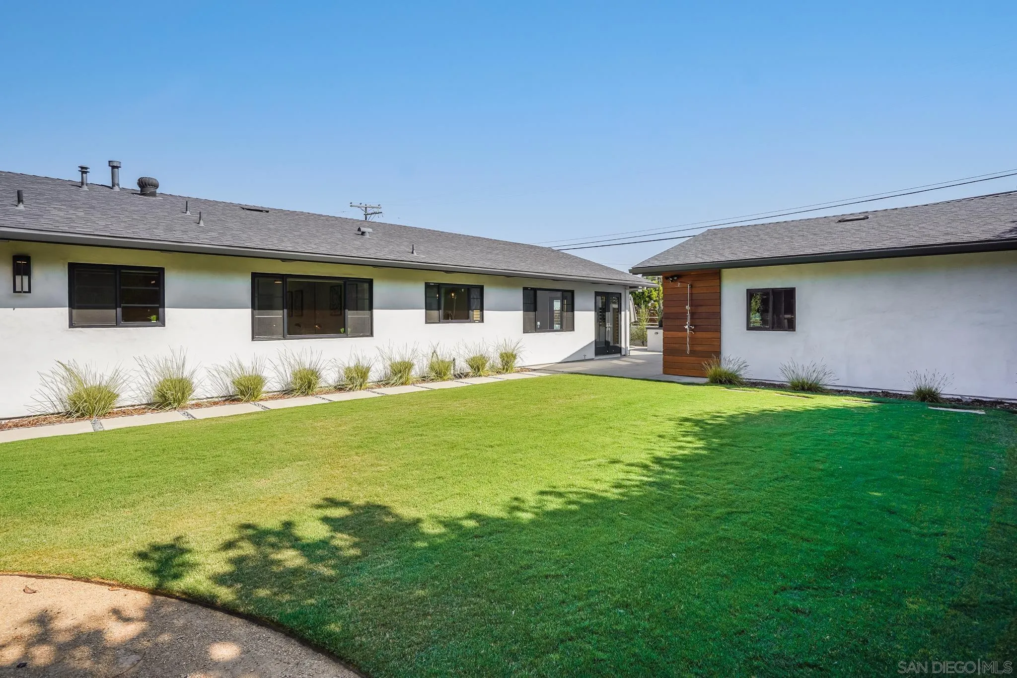 8804 Robinhood Lane La Jolla, CA 92037 - Photo 47 of 58 a front view of house with yard and outdoor seating