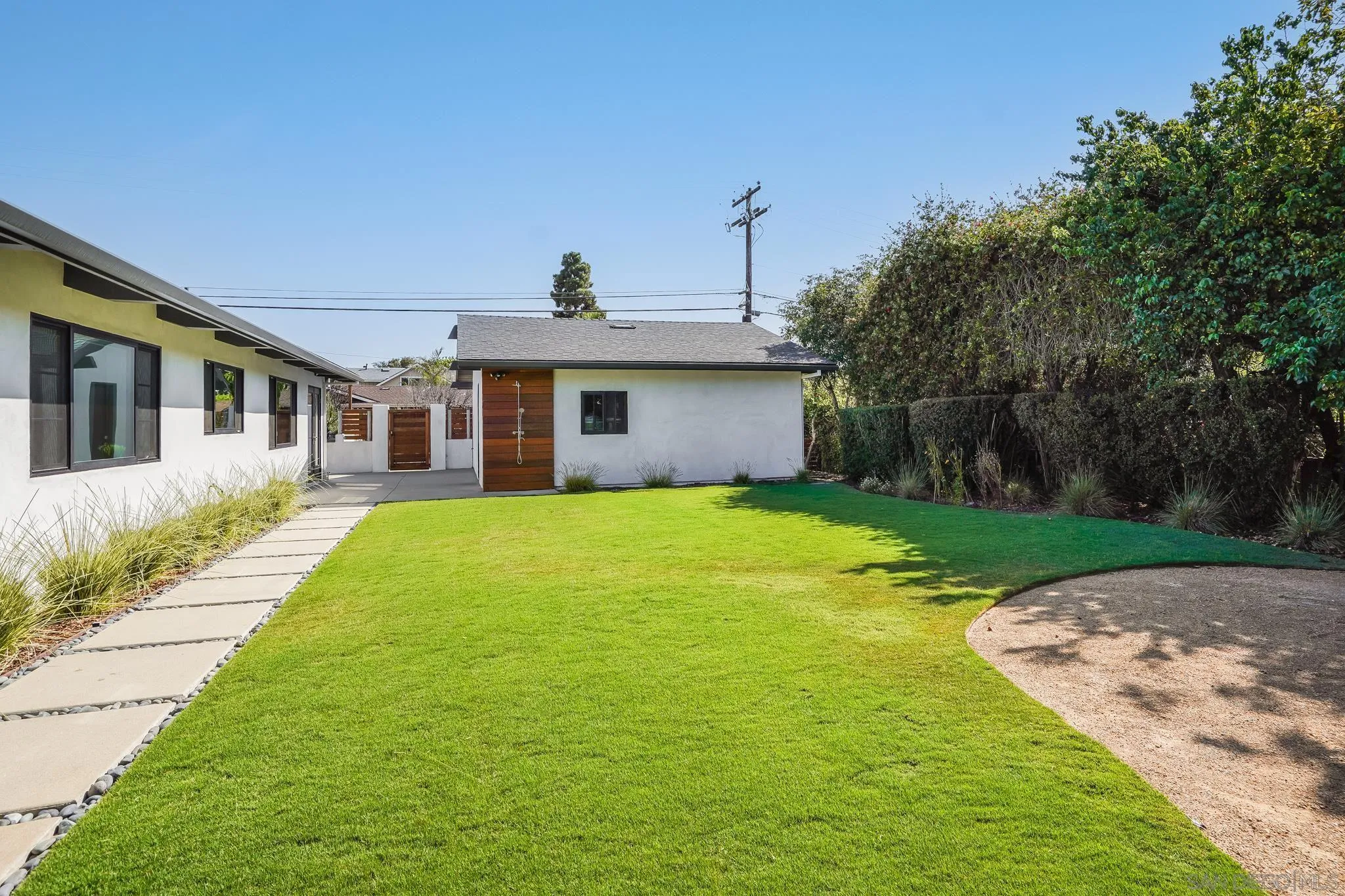 8804 Robinhood Lane La Jolla, CA 92037 - Photo 49 of 58 a view of a house with a yard