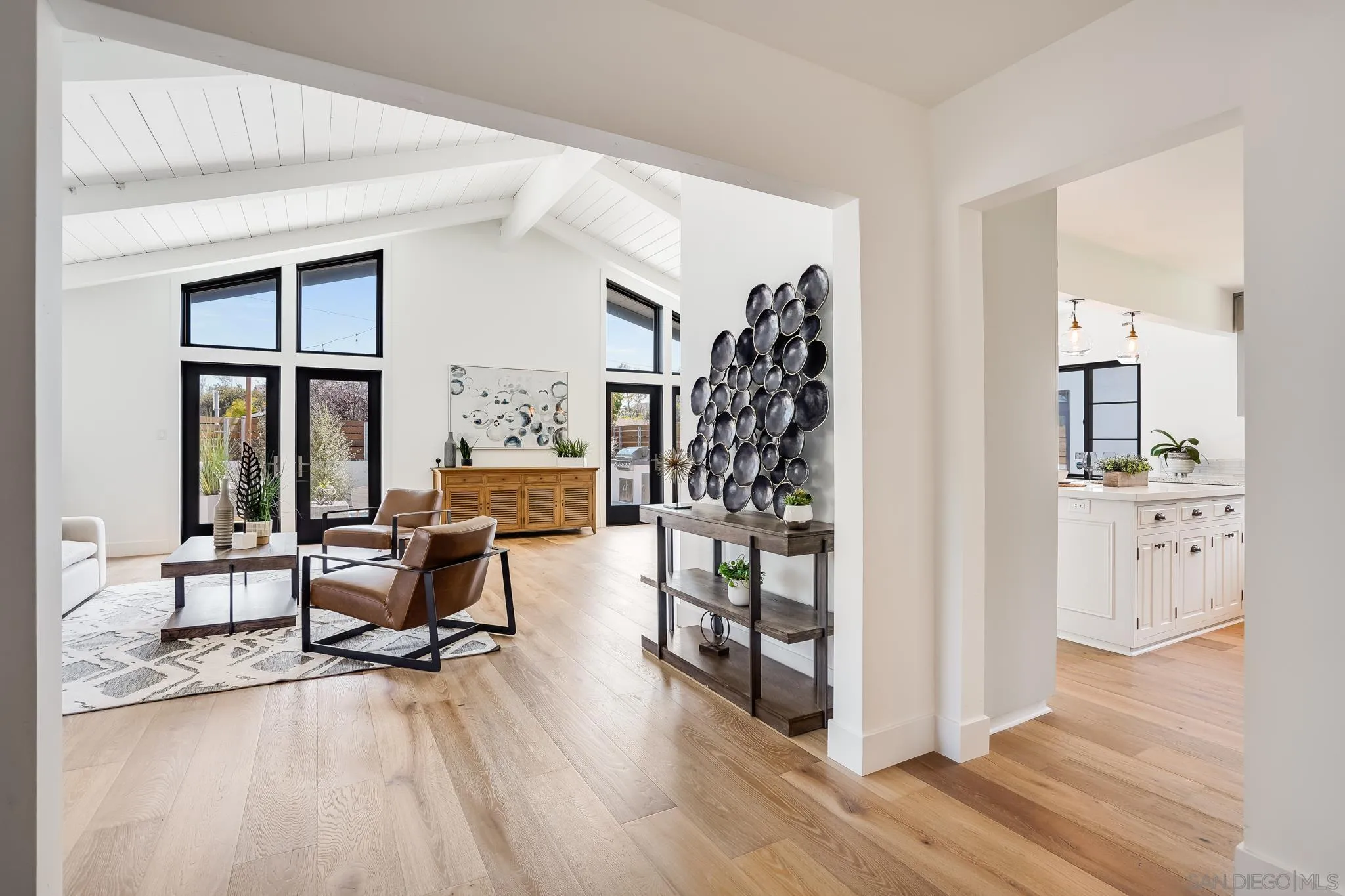 8804 Robinhood Lane La Jolla, CA 92037 - Photo 10 of 58 a view of a livingroom with furniture and floor to ceiling window