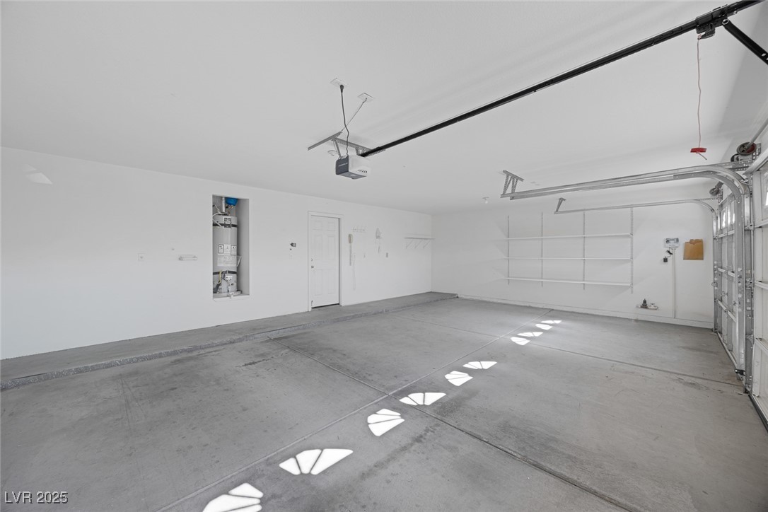 5333 Rim View Lane Las Vegas, NV 89130 - Photo 46 of 55 Garage with secured water heater