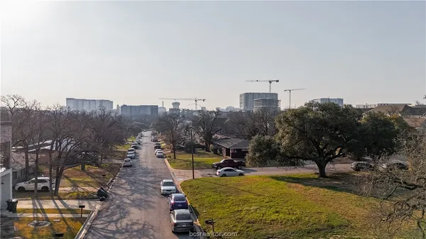a view of a swimming pool and trees in the background