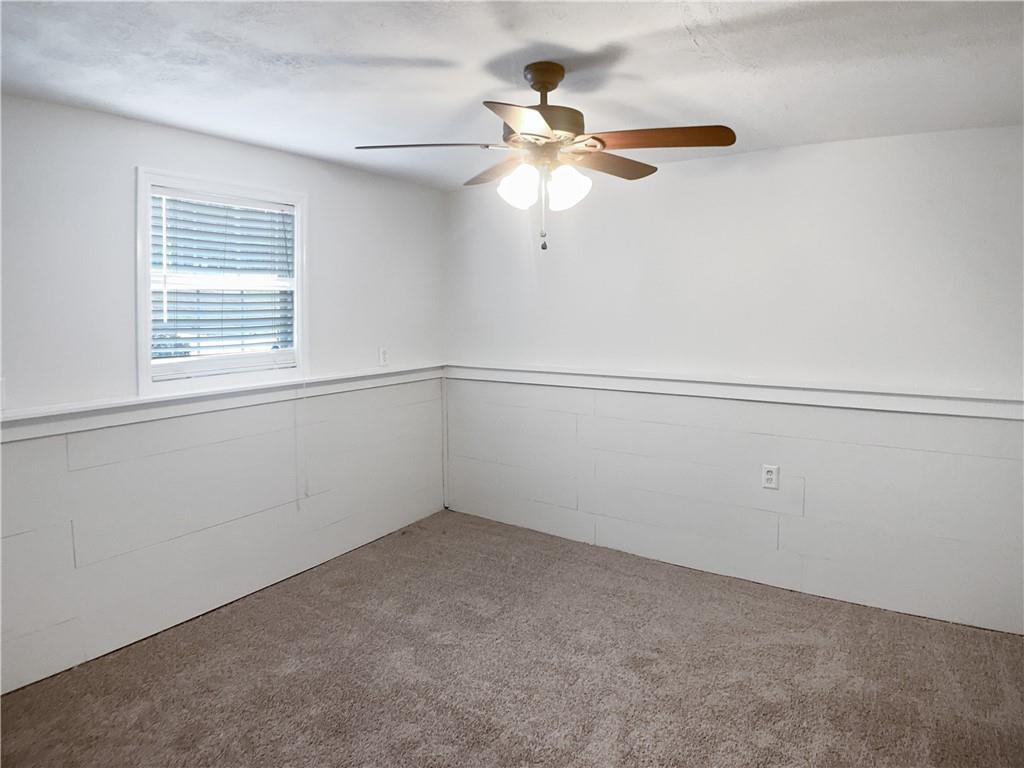1780 North Round Road Lawrenceville, GA 30045 - Photo 12 of 24 an empty room with a window and a fan
