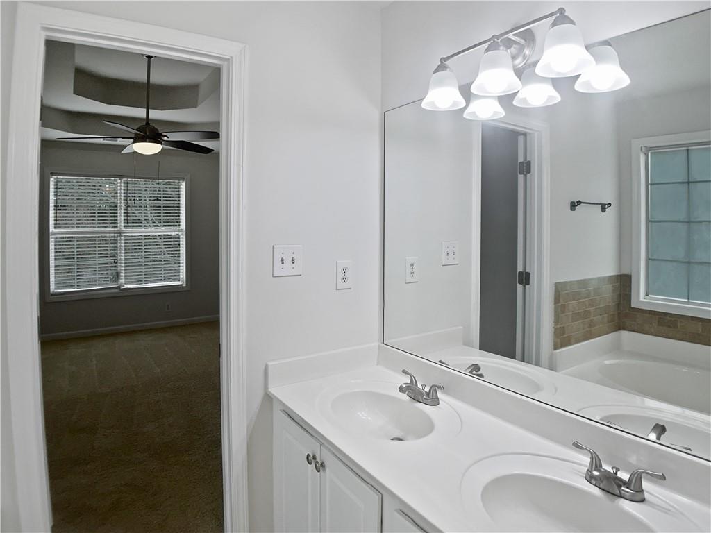 1780 North Round Road Lawrenceville, GA 30045 - Photo 16 of 24 a bathroom with a sink and a mirror
