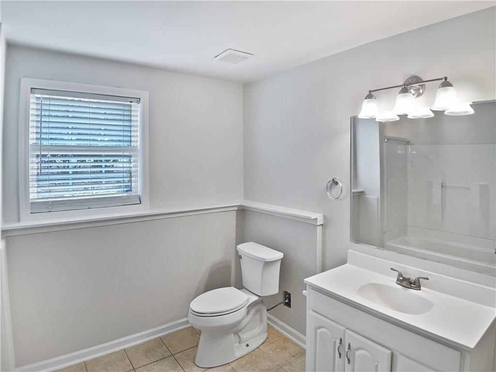 1780 North Round Road Lawrenceville, GA 30045 - Photo 18 of 24 a bathroom with a sink vanity and a toilet