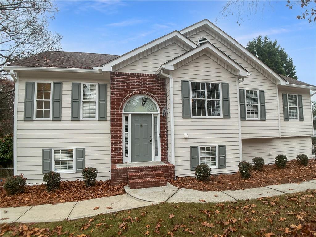1780 North Round Road Lawrenceville, GA 30045 - Photo 2 of 24 a front view of a house with a yard