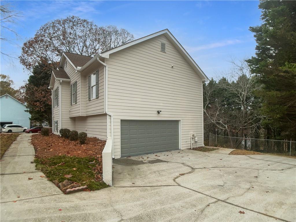 1780 North Round Road Lawrenceville, GA 30045 - Photo 22 of 24 a view of a house with a yard
