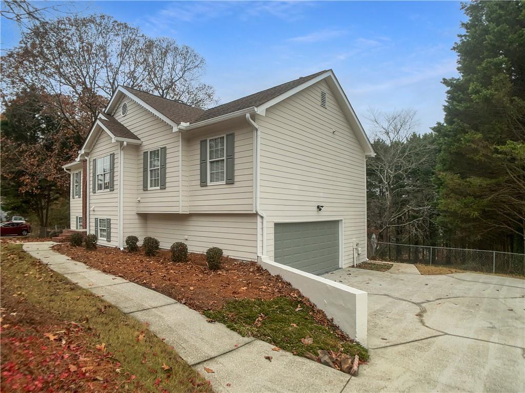 1780 North Round Road Lawrenceville, GA 30045 - Photo 3 of 24 a front view of a house with a yard