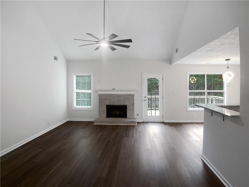 1780 North Round Road Lawrenceville, GA 30045 - Photo 4 of 24 a view of empty room with wooden floor and fan