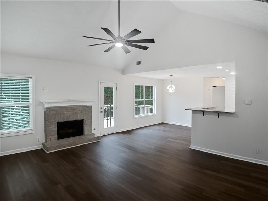 1780 North Round Road Lawrenceville, GA 30045 - Photo 5 of 24 a view of an empty room with wooden floor and a window