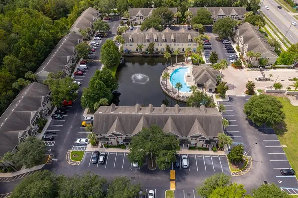 an aerial view of house with yard swimming pool and outdoor seating