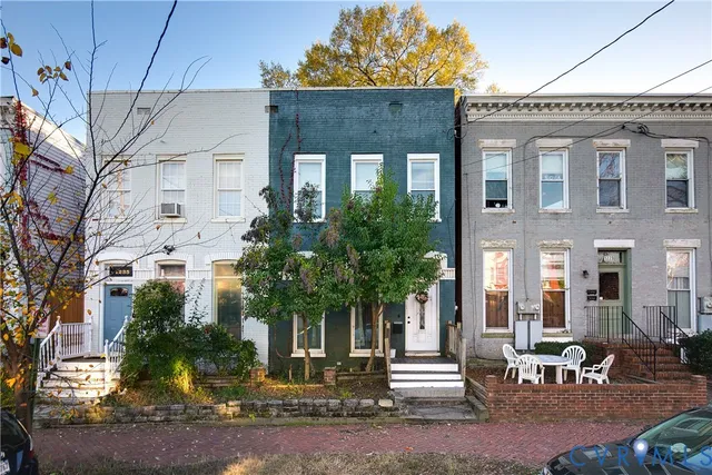 a front view of a building with garden