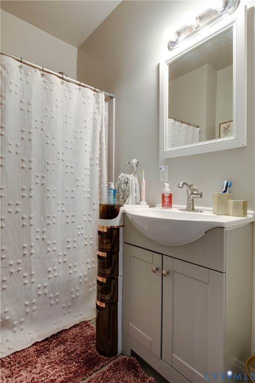 1237 West Cary Street Richmond, VA 23220 - Photo 12 of 23 a bathroom with a sink and a mirror